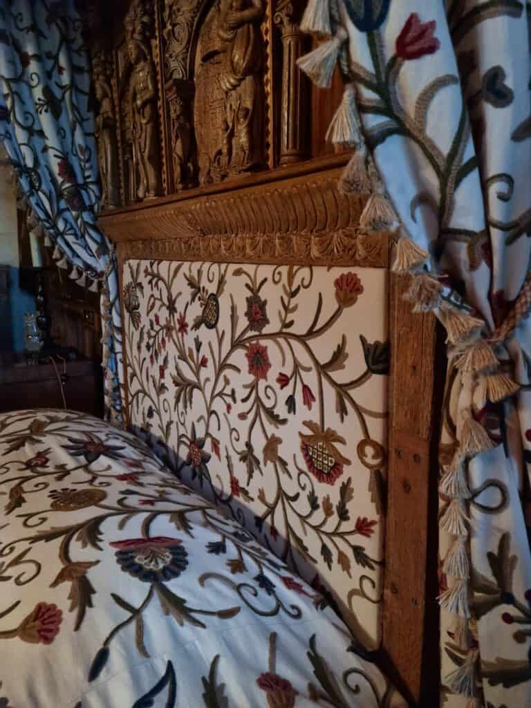 Upholstered patterned headboard with matching bedding