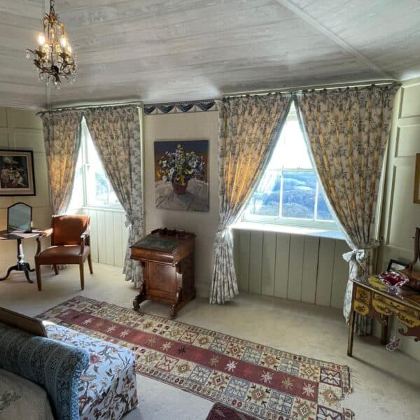 Cream curtains with floral design in bedroom