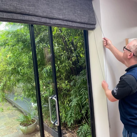 Pete fitting grey roller blind