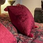 Red cushion with red corner tassels