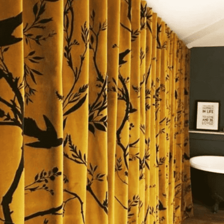 Yellow curtains with black pattern