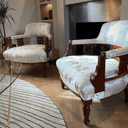 gold and cream chairs with dark wood