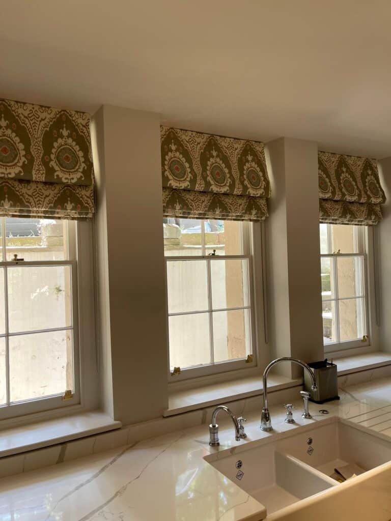 white and grey Patterned blind closed