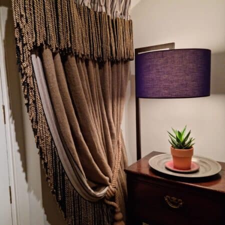 Brown curtains with thick tassel detail
